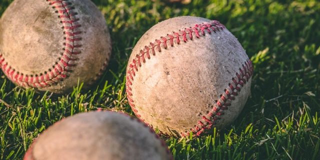 close-up-photography-of-four-baseballs-on-green-lawn-grasses-1308713 (1)